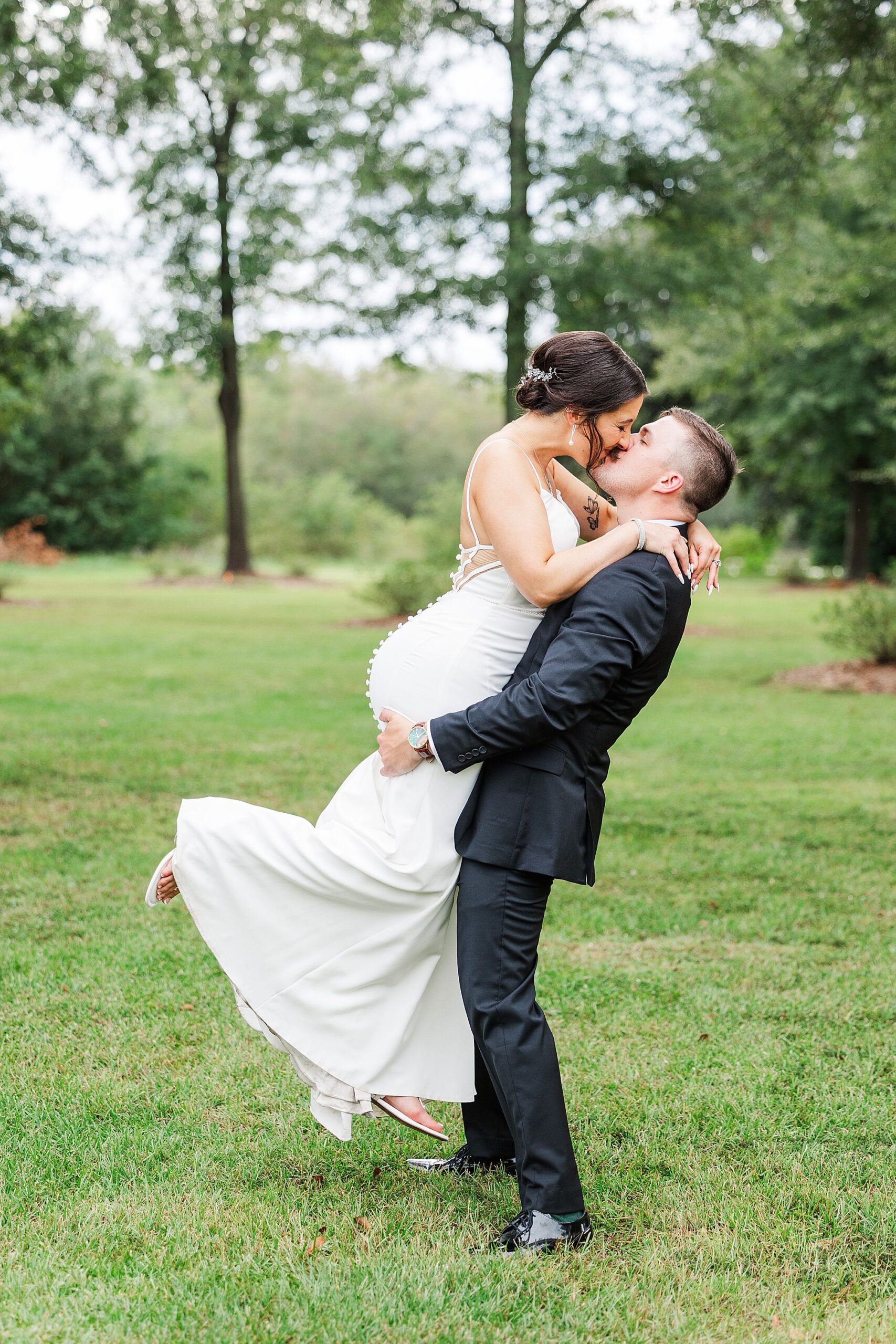 groom picks bride up 