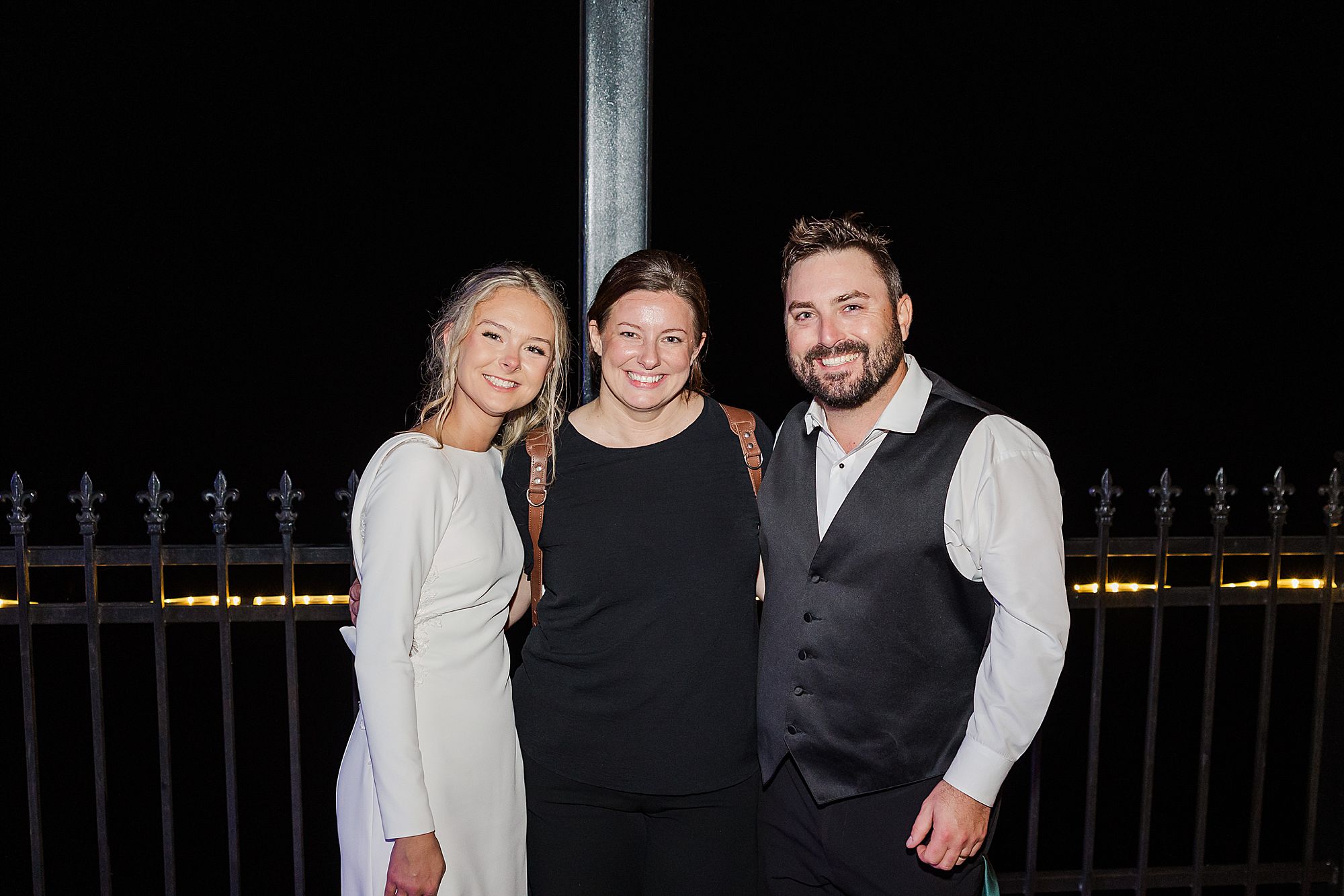 couple with their wedding photographer - Photography by Toni
