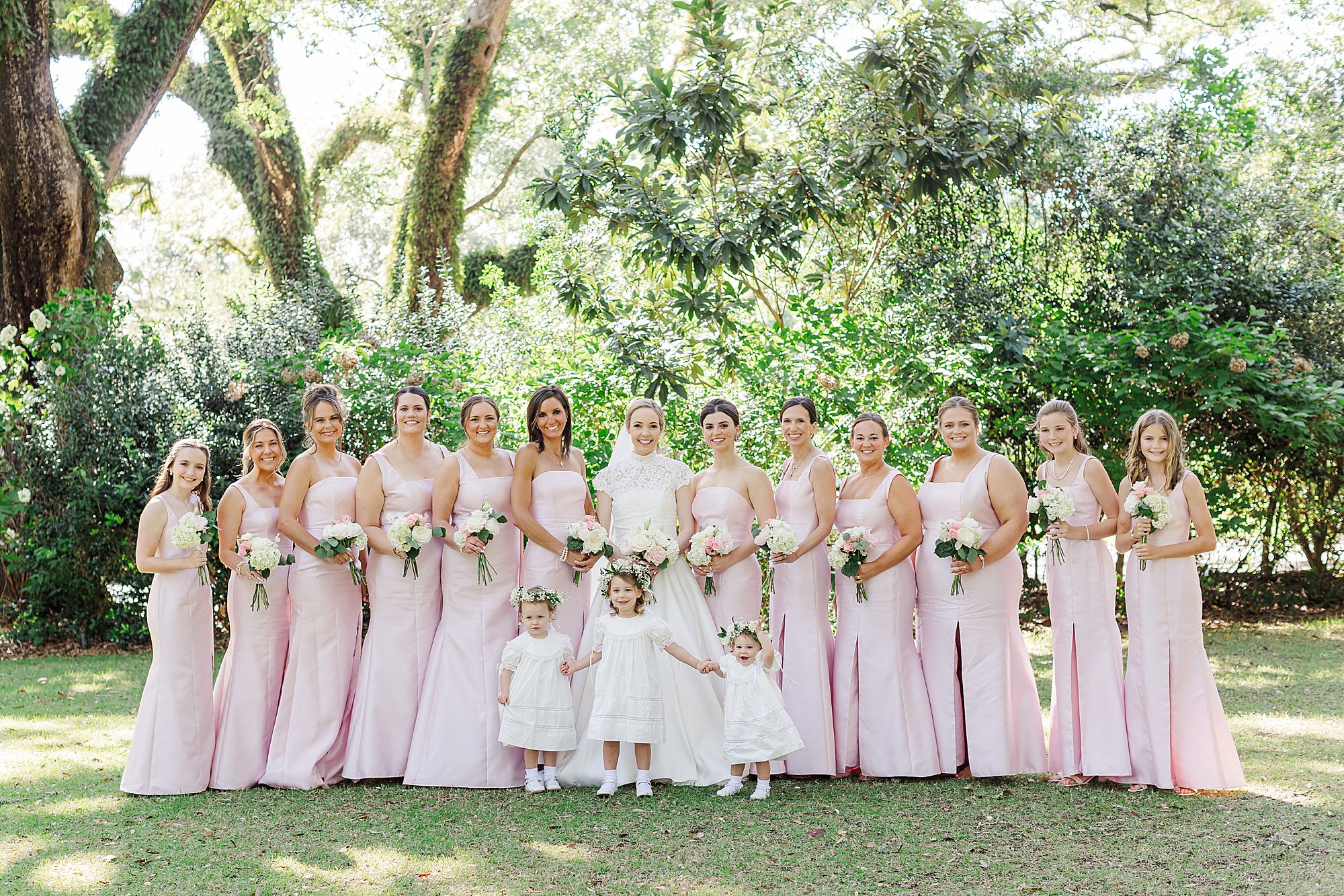 Bride with bridesmaids and flower girls