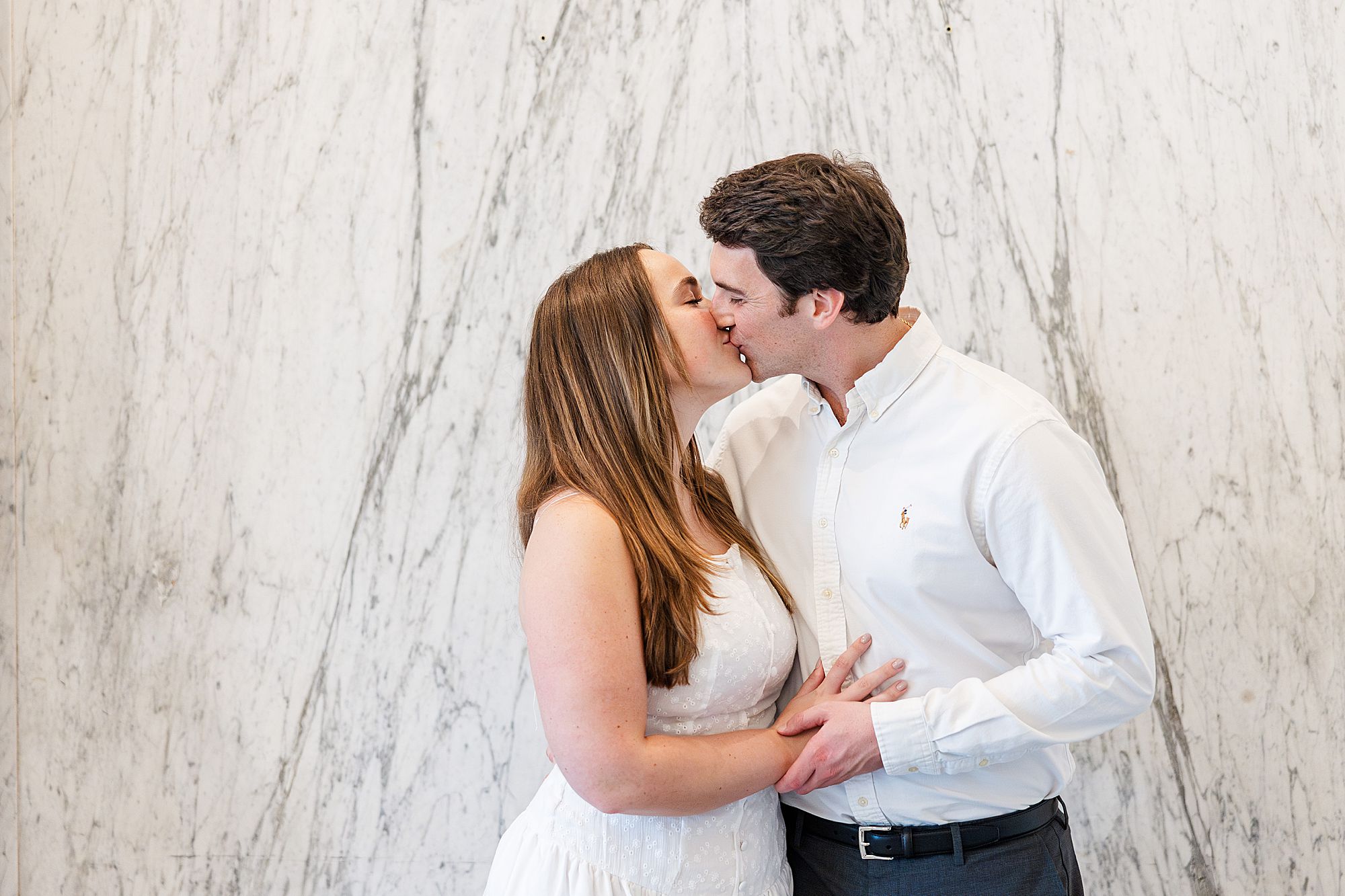 Marble walls inside museum as backdrop for portraits 